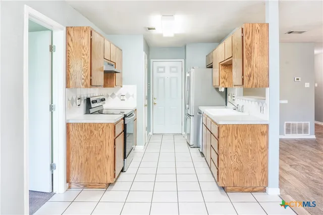 a bathroom with a sink a mirror and a bathtub