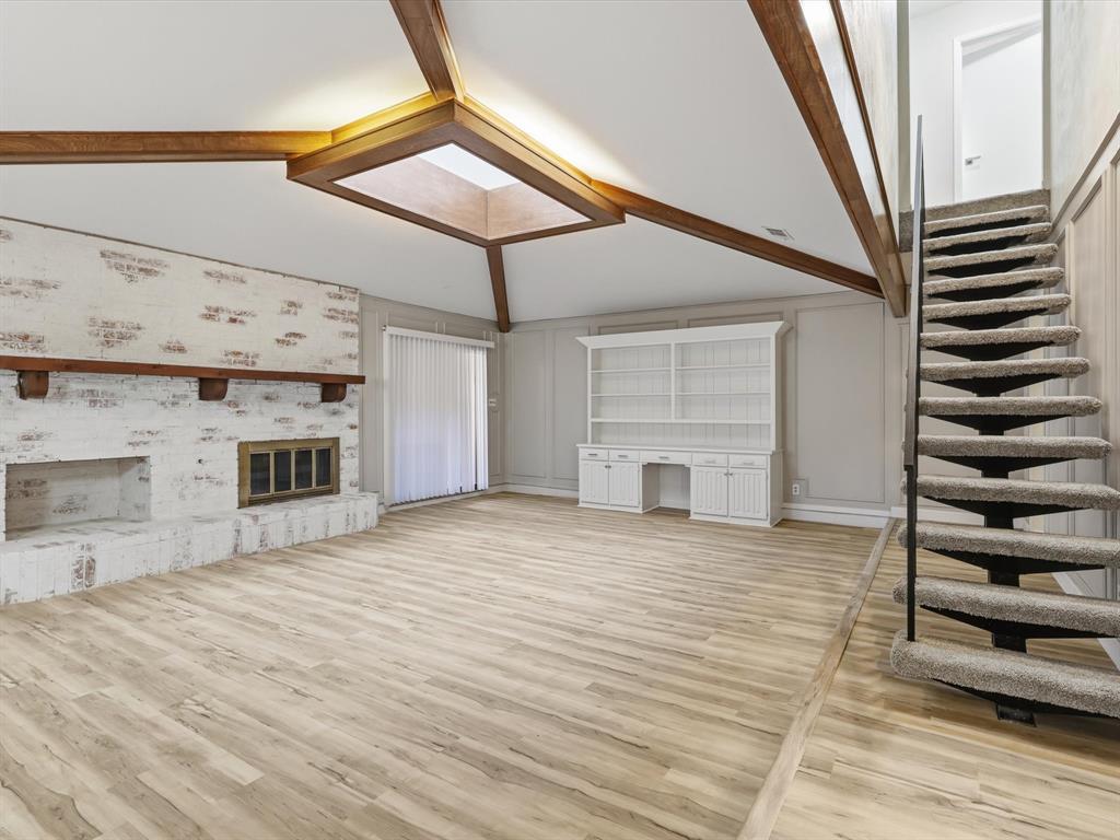 1811 Briarcrest Lane Arlington, TX 76012 - Photo 11 of 29 a view of a livingroom with wooden floor and staircase