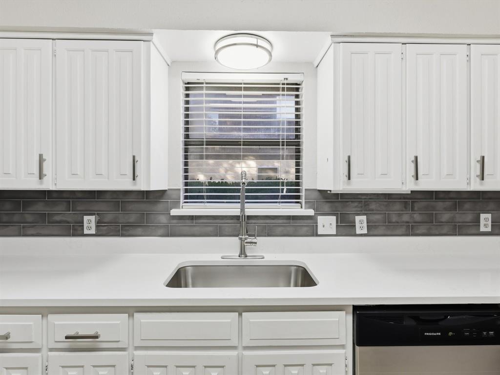 1811 Briarcrest Lane Arlington, TX 76012 - Photo 14 of 29 a kitchen with a sink and cabinets