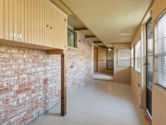a bathroom with a granite countertop sink a toilet and a bathtub