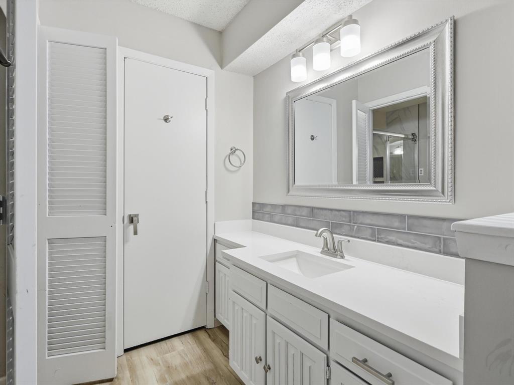 1811 Briarcrest Lane Arlington, TX 76012 - Photo 25 of 29 a bathroom with a sink and a mirror