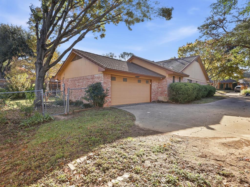 1811 Briarcrest Lane Arlington, TX 76012 - Photo 29 of 29 a view of a house with a yard