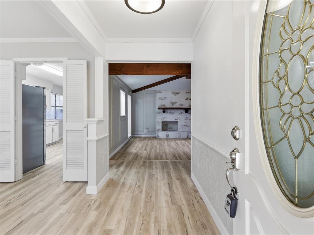 1811 Briarcrest Lane Arlington, TX 76012 - Photo 3 of 29 a view of a livingroom with wooden floor and staircase
