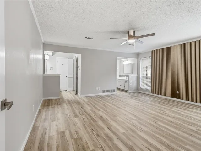 a bathroom with a shower and a sink
