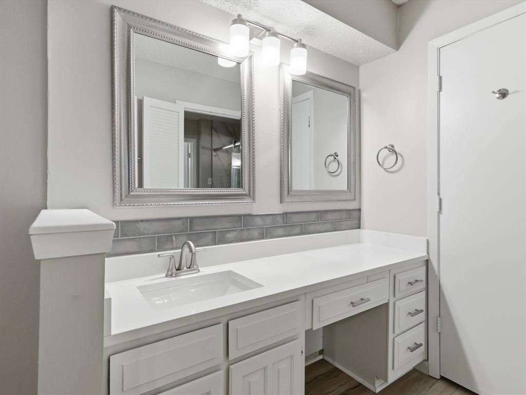 1811 Briarcrest Lane Arlington, TX 76012 - Photo 10 of 29 a bathroom with a sink and a mirror