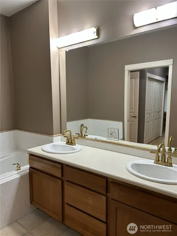a bathroom with a bathtub and a sink