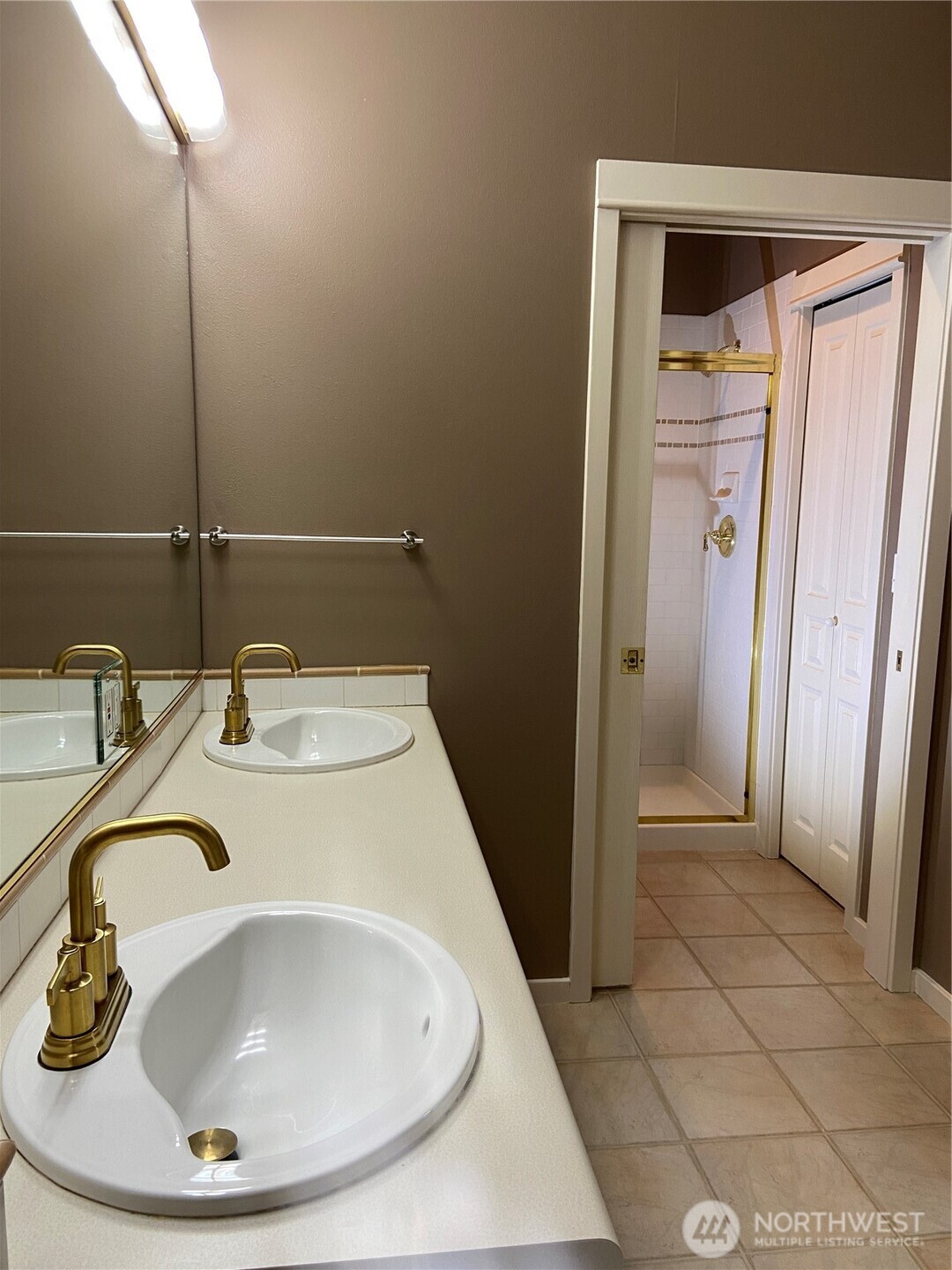 1900 Alaskan Way, Unit 402 Seattle, WA 98101 - Photo 22 of 32 a bathroom with a sink and a mirror