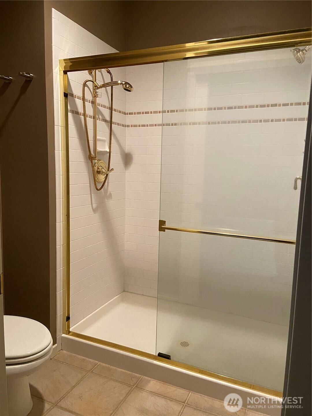 1900 Alaskan Way, Unit 402 Seattle, WA 98101 - Photo 23 of 32 a bathroom with a shower and toilet