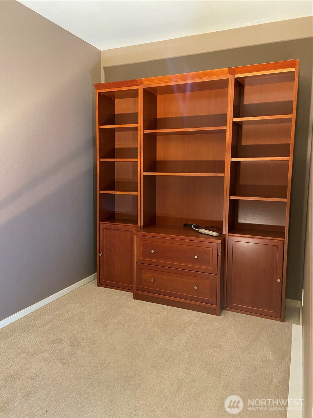 1900 Alaskan Way, Unit 402 Seattle, WA 98101 - Photo 24 of 32 a room with cabinets and a closet