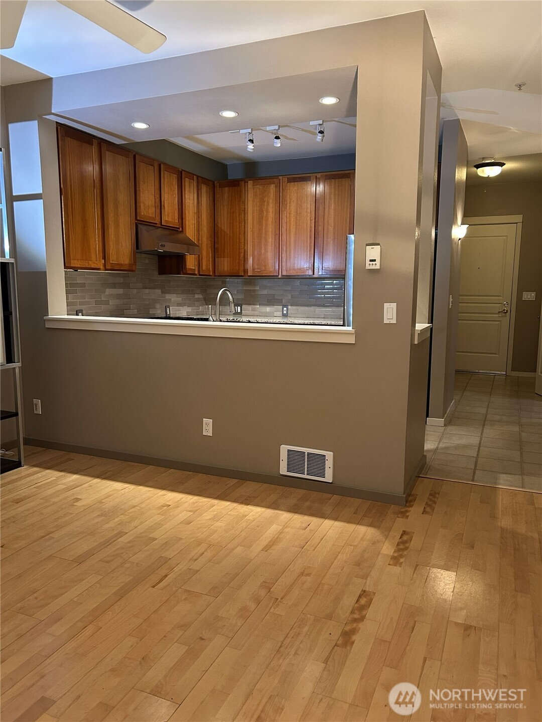 1900 Alaskan Way, Unit 402 Seattle, WA 98101 - Photo 10 of 32 a view of kitchen with window and cabinets