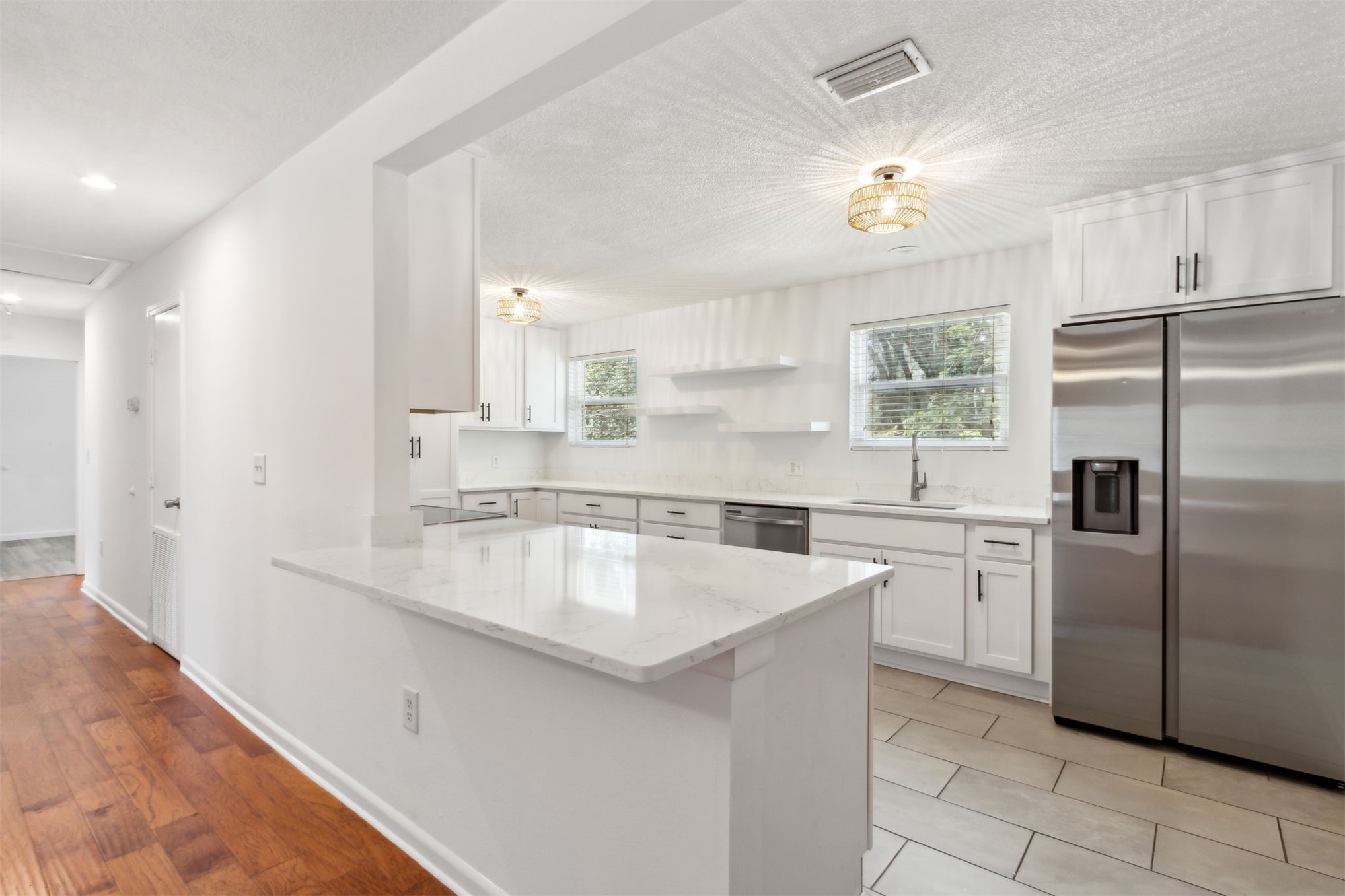 2441 Amelia Road Fernandina Beach, FL 32034 - Photo 13 of 36 a kitchen with a sink stove and refrigerator