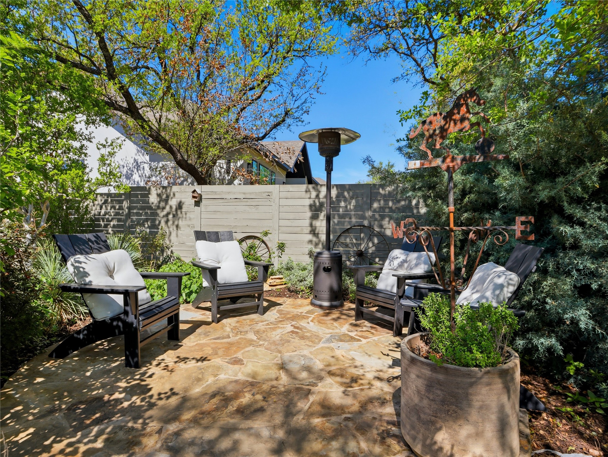 112 Mountain Lion Road Georgetown, TX 78628 - Photo 31 of 37 a view of a patio with table and chairs and potted plants