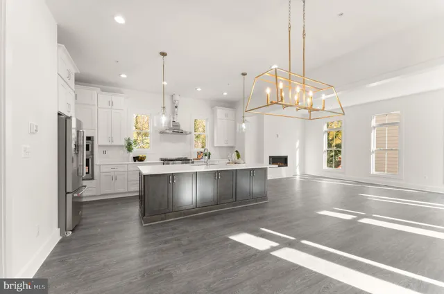 a kitchen with counter top space and appliances
