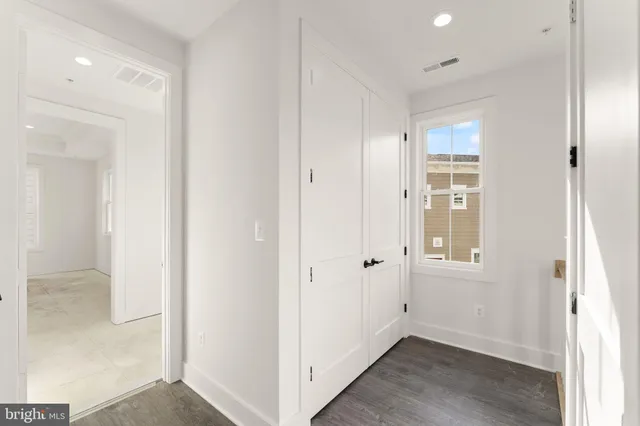 a bathroom with a shower sink double vanity and mirror