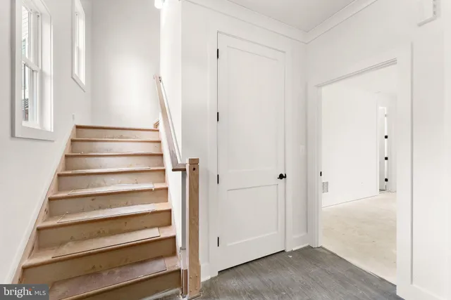 a bathroom with a sink vanity granite toilet and a shower