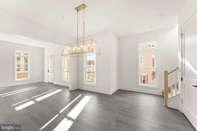 a view of a kitchen with a sink stainless steel appliances and cabinets