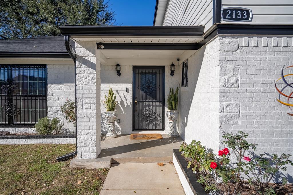 2133 Pleasant Drive Dallas, TX 75227 - Photo 2 of 40 Entrance to property featuring a porch and brick siding