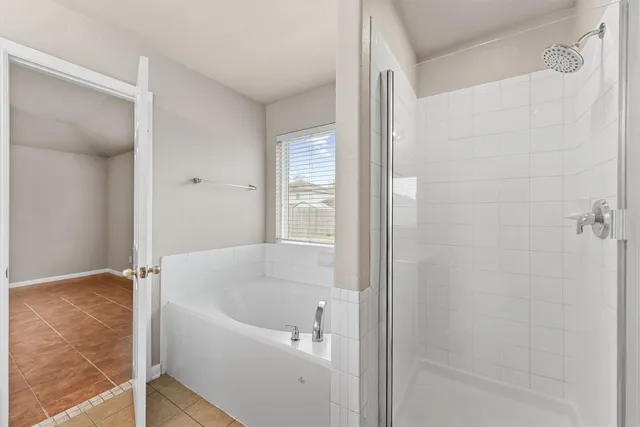 a white bath tub sitting next to a white sink
