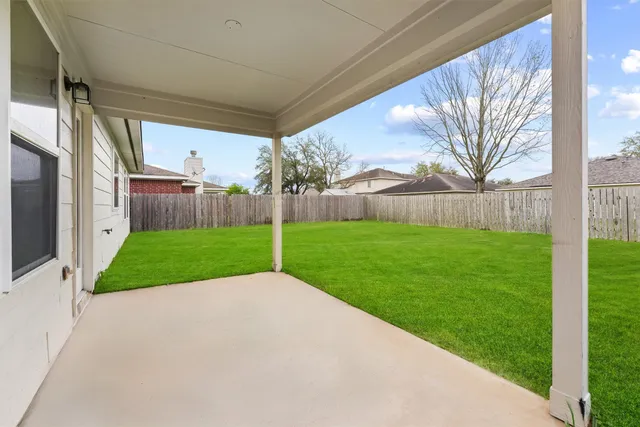 a view of a yard with a house
