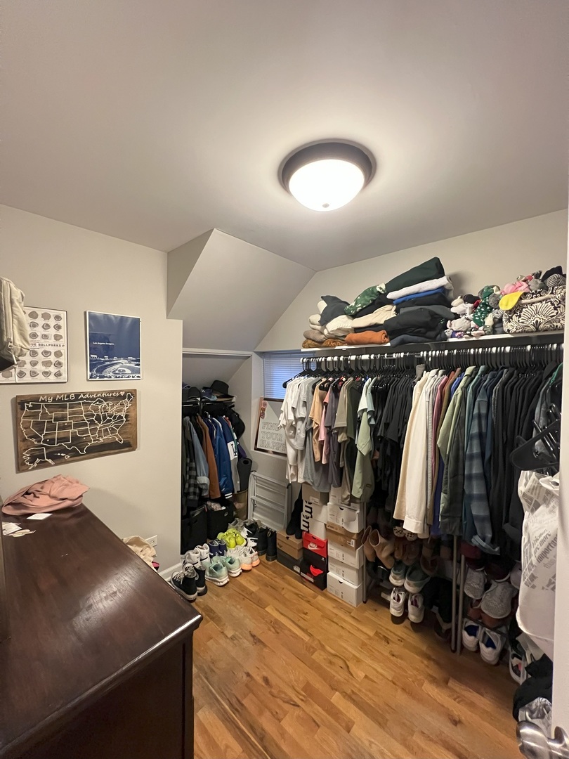 1532 West 18th Place, Unit 1F Chicago, IL 60608 - Photo 14 of 14 a view of walk in closet with clothes and shoes