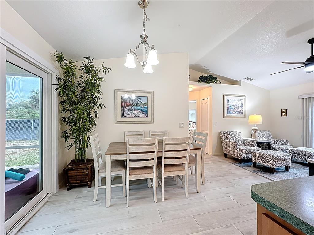 2500 Allegheny Lane North Port, FL 34286 - Photo 20 of 46 a living room with furniture a chandelier and a window