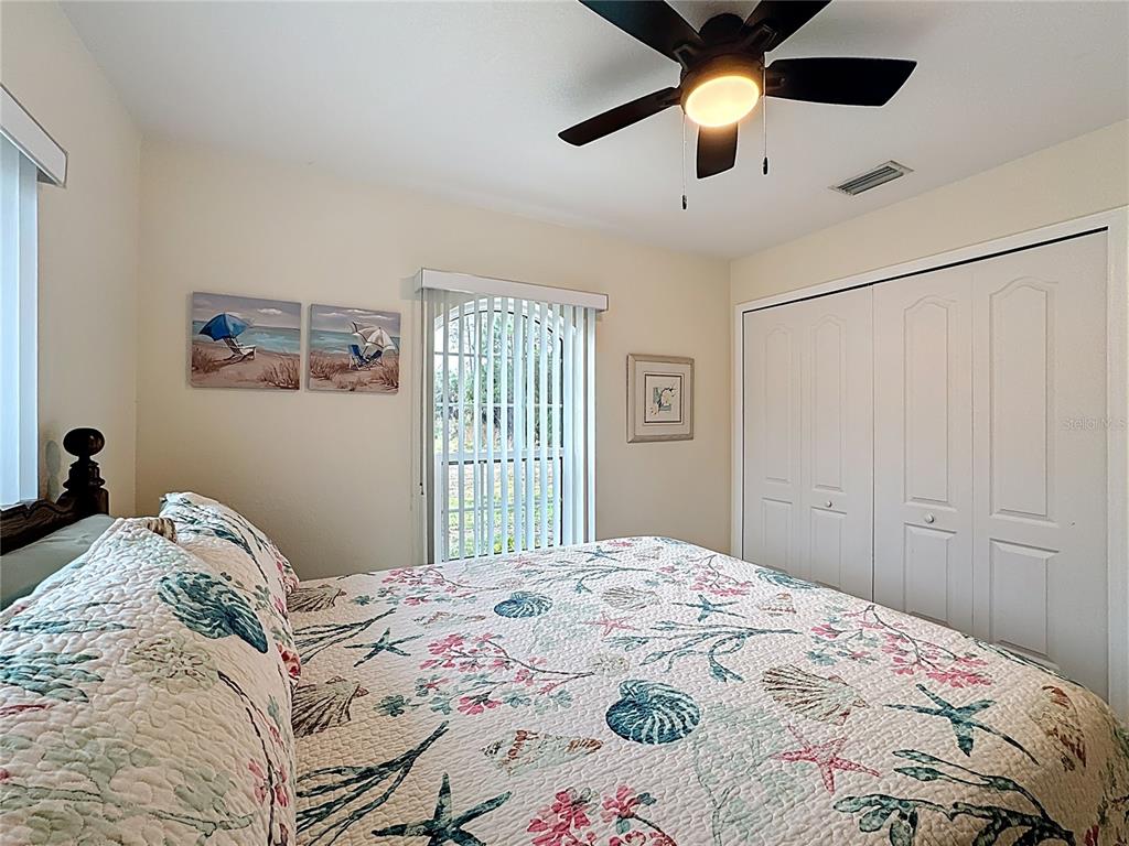 2500 Allegheny Lane North Port, FL 34286 - Photo 23 of 46 a bedroom with a bed and a chandelier