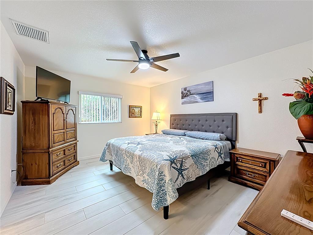 2500 Allegheny Lane North Port, FL 34286 - Photo 27 of 46 a bedroom with a bed dresser and a window