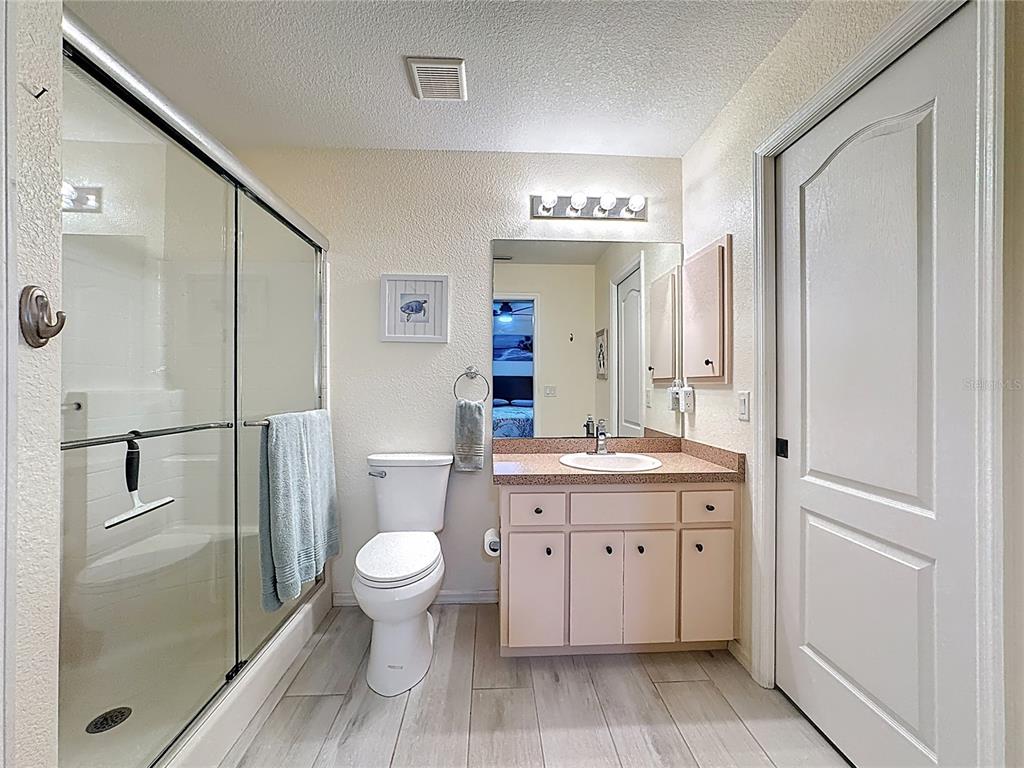 2500 Allegheny Lane North Port, FL 34286 - Photo 29 of 46 a spacious bathroom with a granite countertop sink toilet and shower