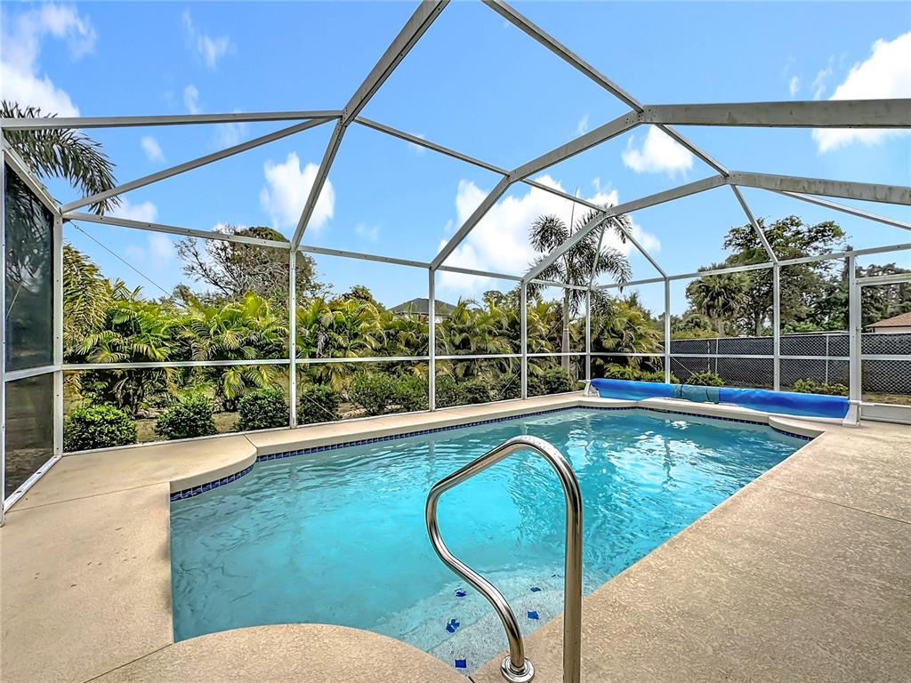 2500 Allegheny Lane North Port, FL 34286 - Photo 36 of 46 a view of a swimming pool with a porch