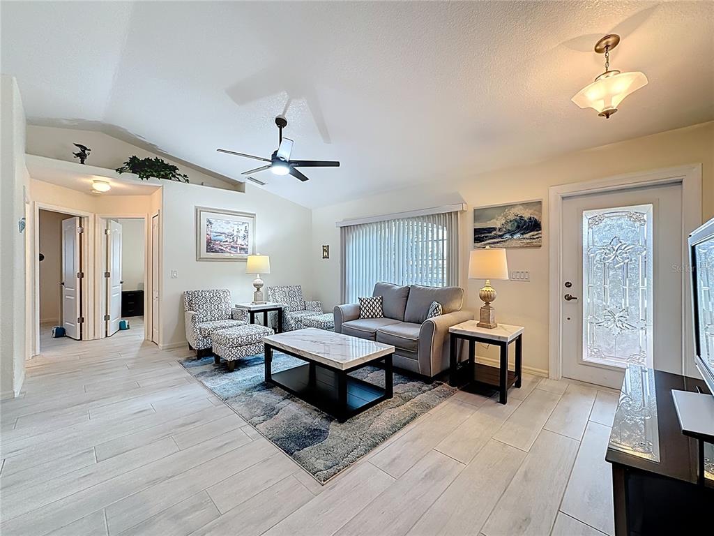 2500 Allegheny Lane North Port, FL 34286 - Photo 6 of 46 a living room with furniture and a chandelier