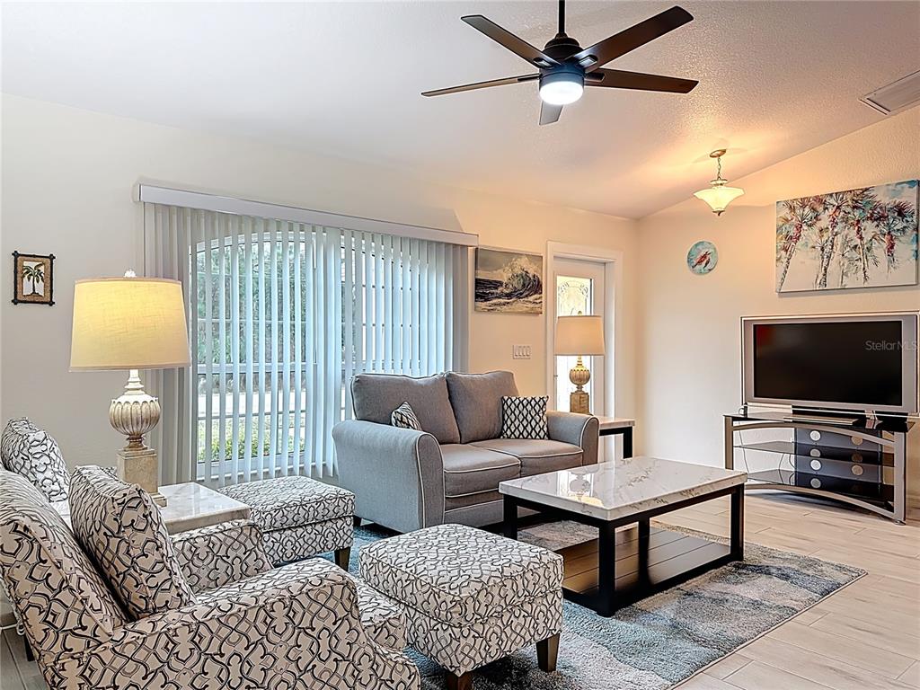 2500 Allegheny Lane North Port, FL 34286 - Photo 7 of 46 a living room with furniture and a flat screen tv