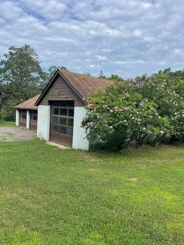a backyard of a house with lots of green space