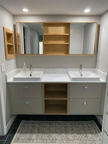 a bathroom with a sink and a mirror