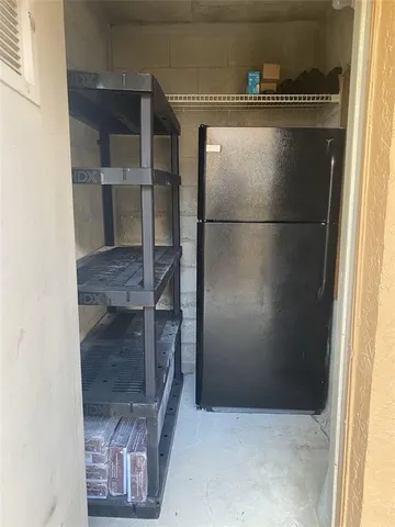 a kitchen with a refrigerator