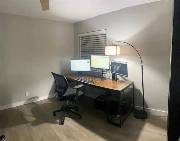 a view of a workspace with furniture