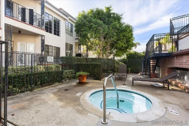 a view of a swimming pool with a patio