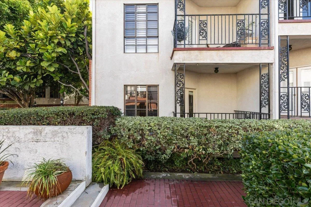 2630 Pirineos Way, Unit 5 Carlsbad, CA 92009 - Photo 28 of 48 front view of a house with a yard