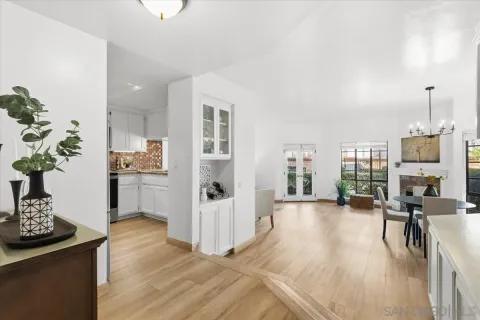 a view of a living room and kitchen with furniture