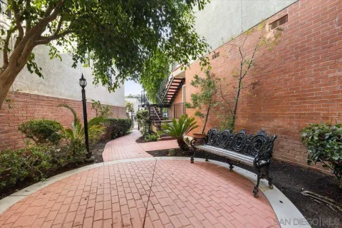 a bench is sitting in middle of garden