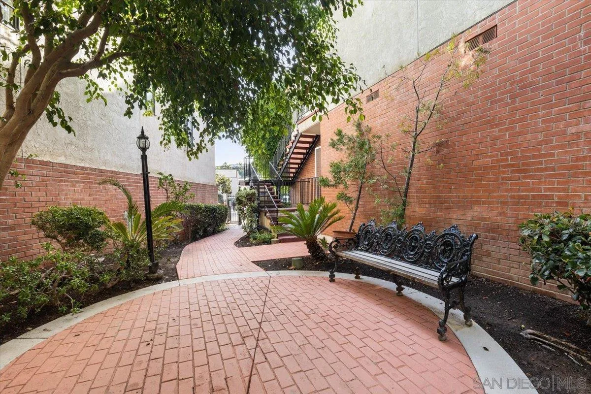 2630 Pirineos Way, Unit 5 Carlsbad, CA 92009 - Photo 32 of 48 a bench is sitting in middle of garden