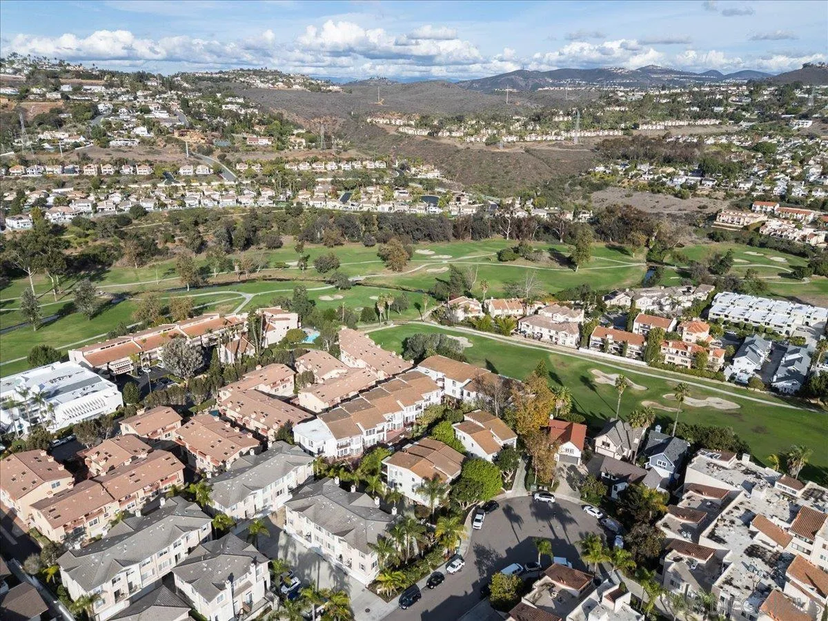 2630 Pirineos Way, Unit 5 Carlsbad, CA 92009 - Photo 36 of 48 an aerial view of lake and residential houses with outdoor space