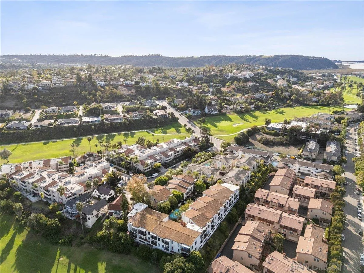 2630 Pirineos Way, Unit 5 Carlsbad, CA 92009 - Photo 40 of 48 a view of a city with mountains in the background
