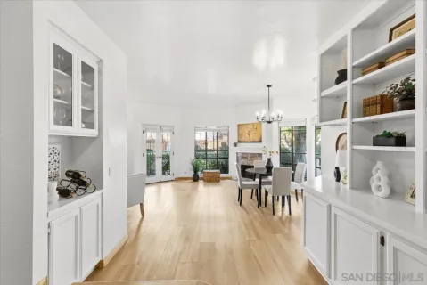 a very nice looking living room with a large window and a wooden floor