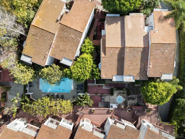 a view of a patio with table and chairs and potted plants