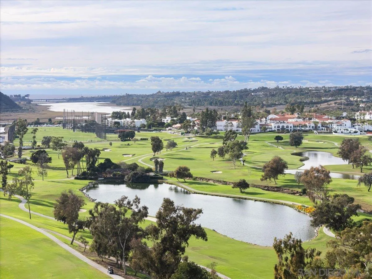 2630 Pirineos Way, Unit 5 Carlsbad, CA 92009 - Photo 47 of 48 an aerial view of a city with lots of residential buildings ocean and mountain view in back