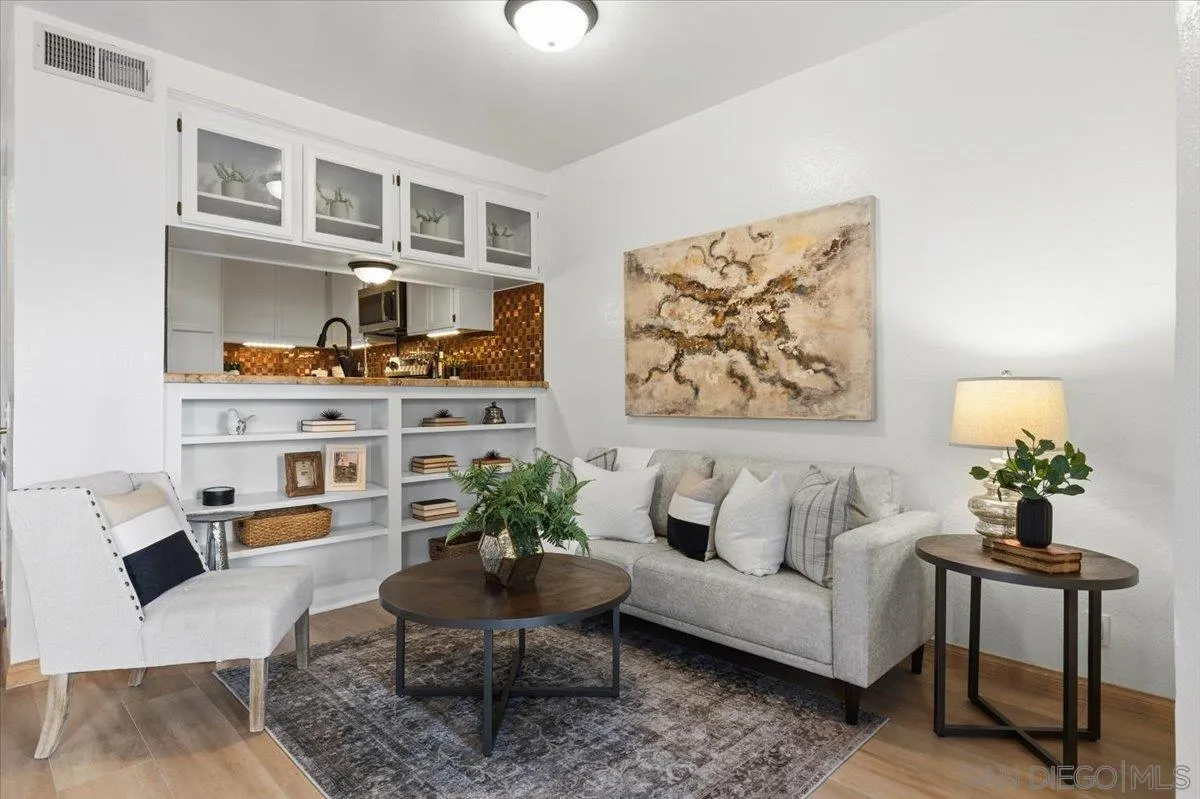 2630 Pirineos Way, Unit 5 Carlsbad, CA 92009 - Photo 6 of 48 a living room with furniture and painting on the wall