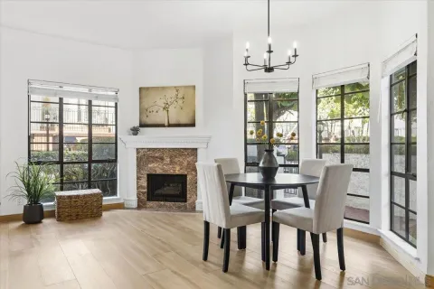 a view of a livingroom with furniture window and wooden floor