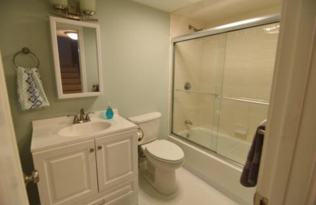 84 Gordon Street, Unit 206 Boston, MA 02135 - Photo 14 of 15 a bathroom with a sink a toilet and shower