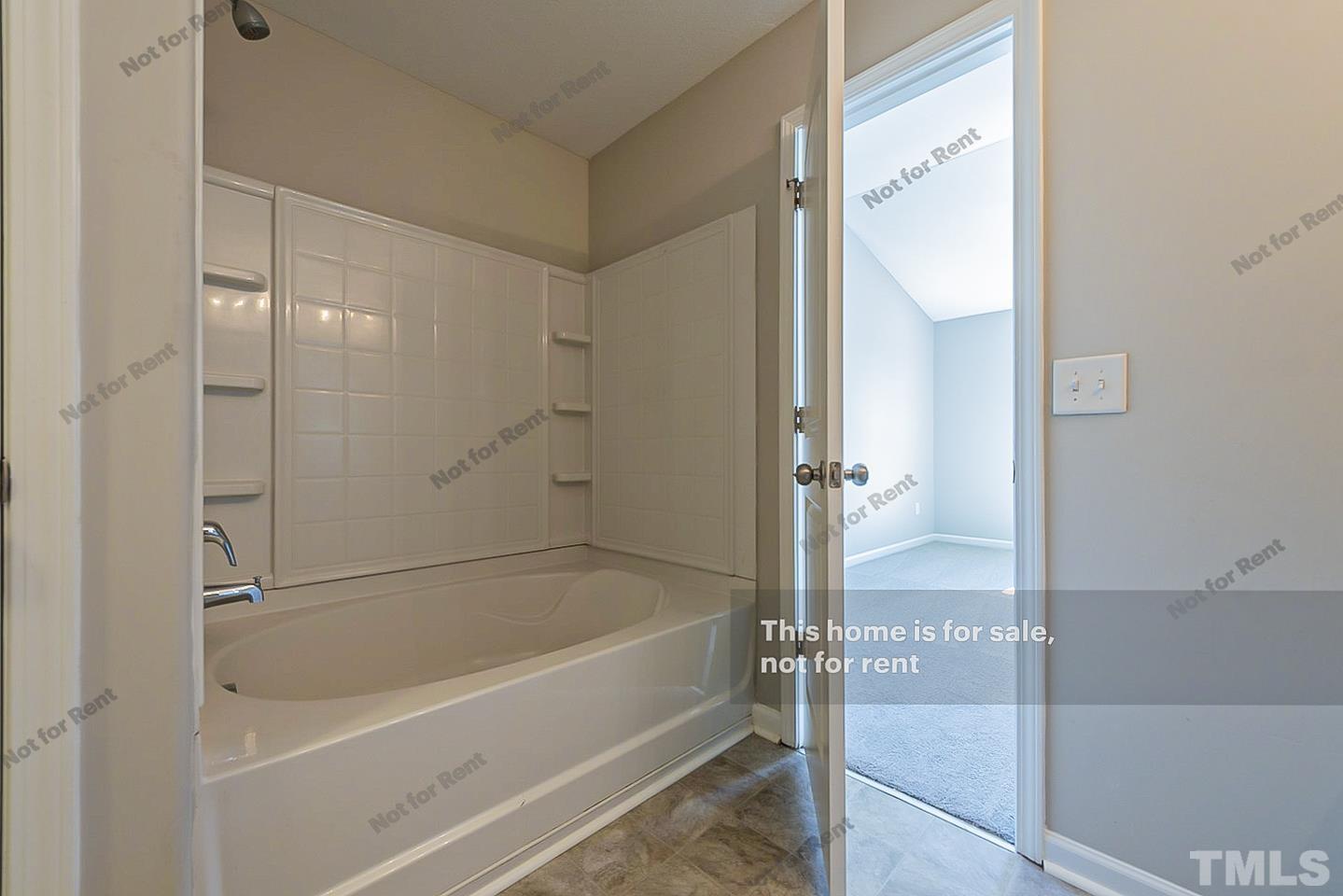 1908 Buffalo Way Durham, NC 27704 - Photo 19 of 26 a bathroom with a bathtub and a shower