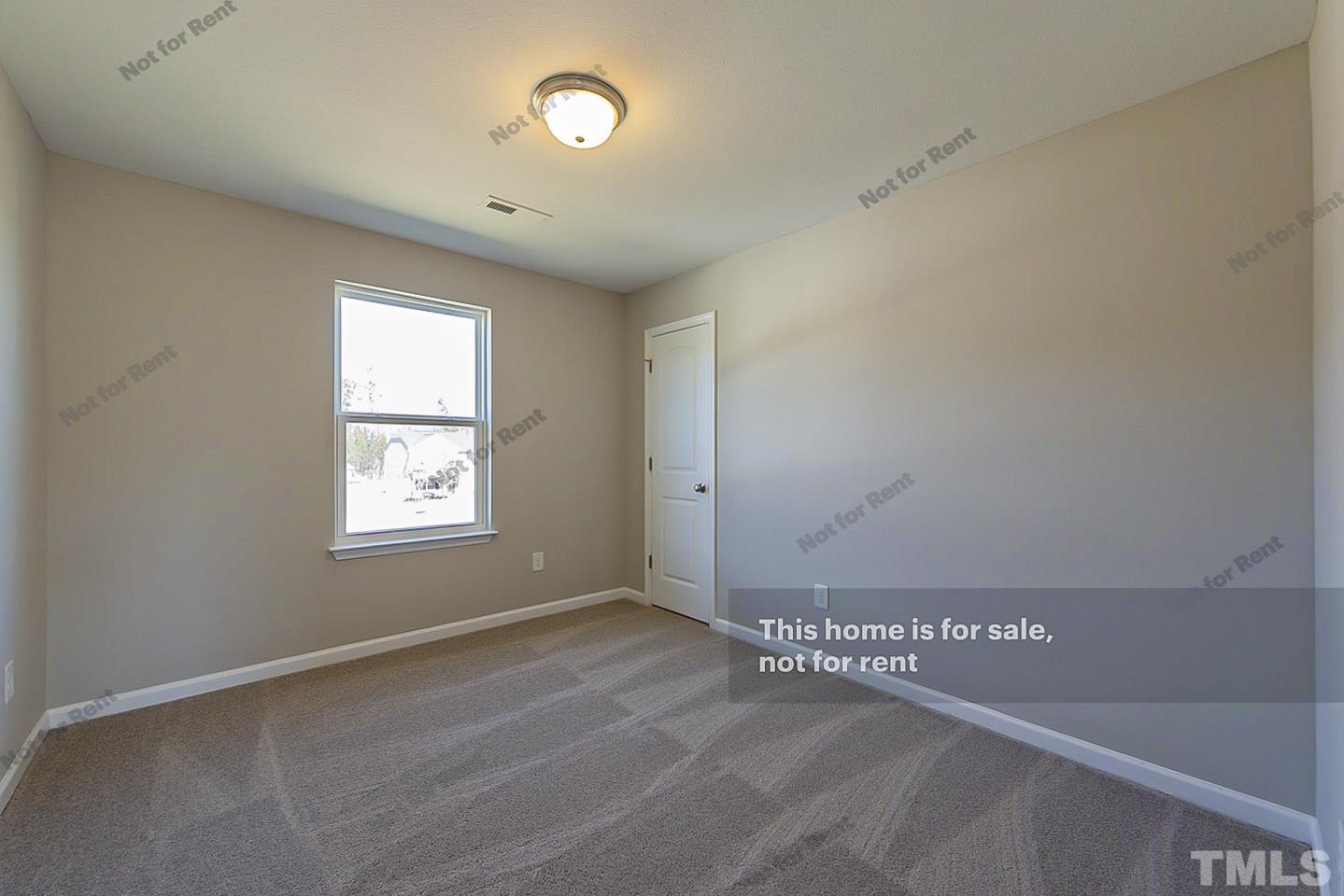 1908 Buffalo Way Durham, NC 27704 - Photo 20 of 26 an empty room with a window